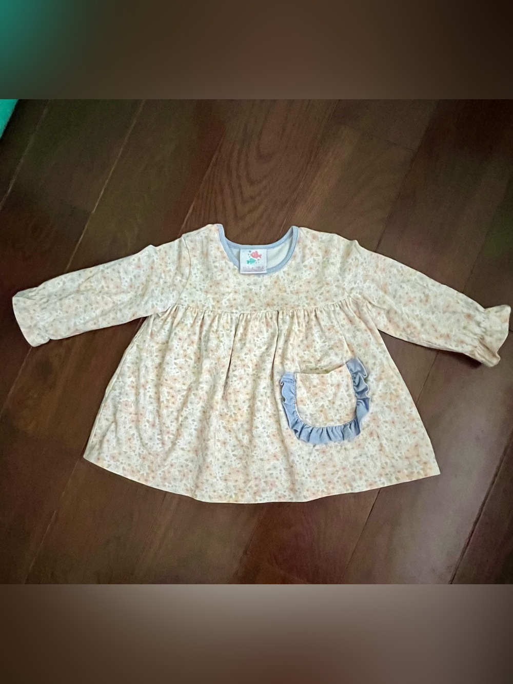 Stitchy Fish Floral Ruffle Pocket Baby Top in Pastel Yellow